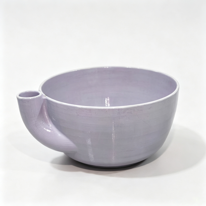 Rotating vegetable and fruit rinsing bowl with a central conical hole