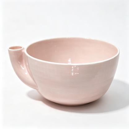 Rotating vegetable and fruit rinsing bowl with a central conical hole