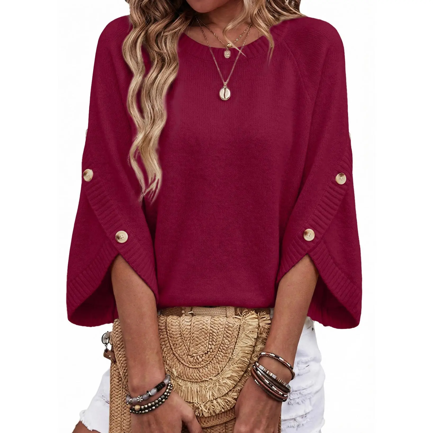 Women's loose-fitting crew neck sweater with three-quarter sleeves and buttoned cuffs