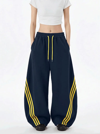 Retro Triple-Stripe Wide-Leg Pants Relaxed Comfort. Effortlessly Cool.